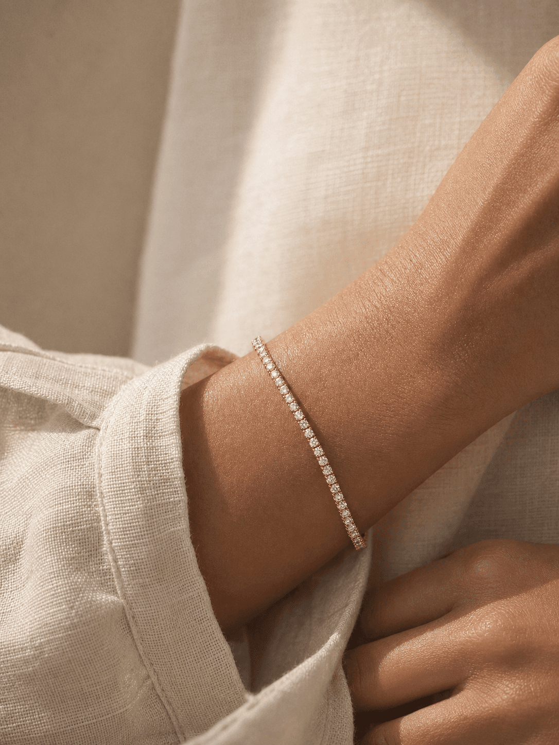 Moissanite bracelet worn with ivory linen