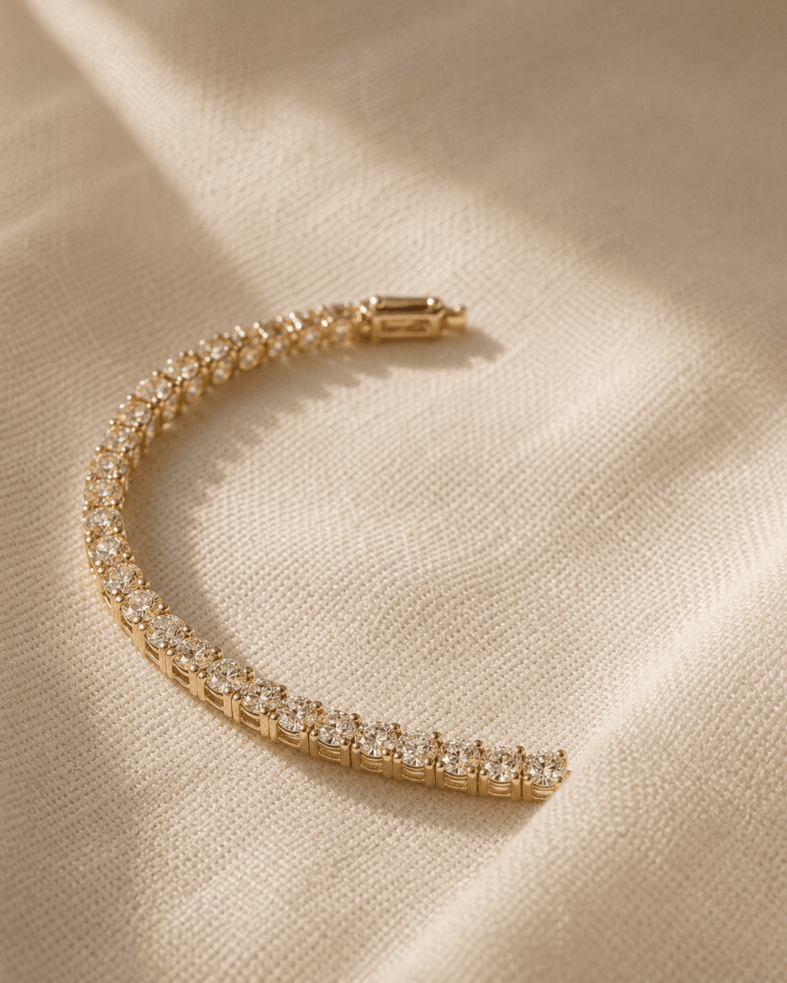 Moissanite bracelet on warm ivory background